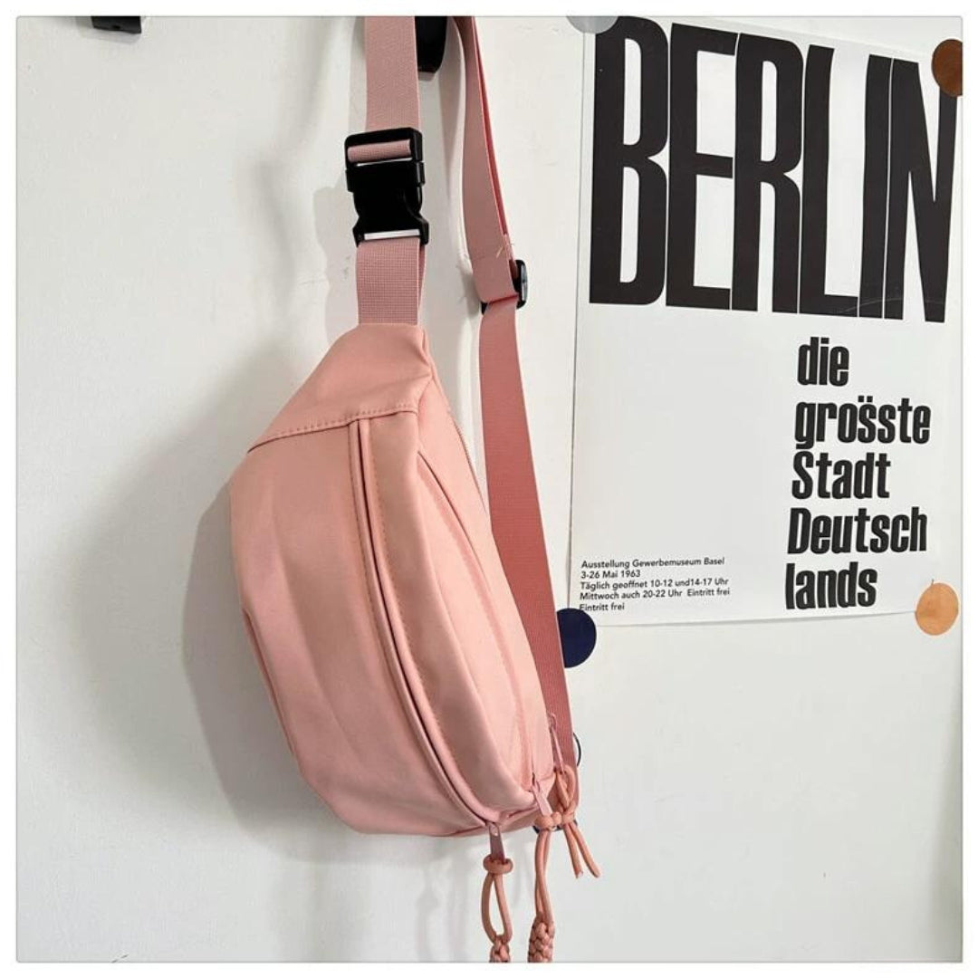 Solid-color cross-body bag for travel with pendant