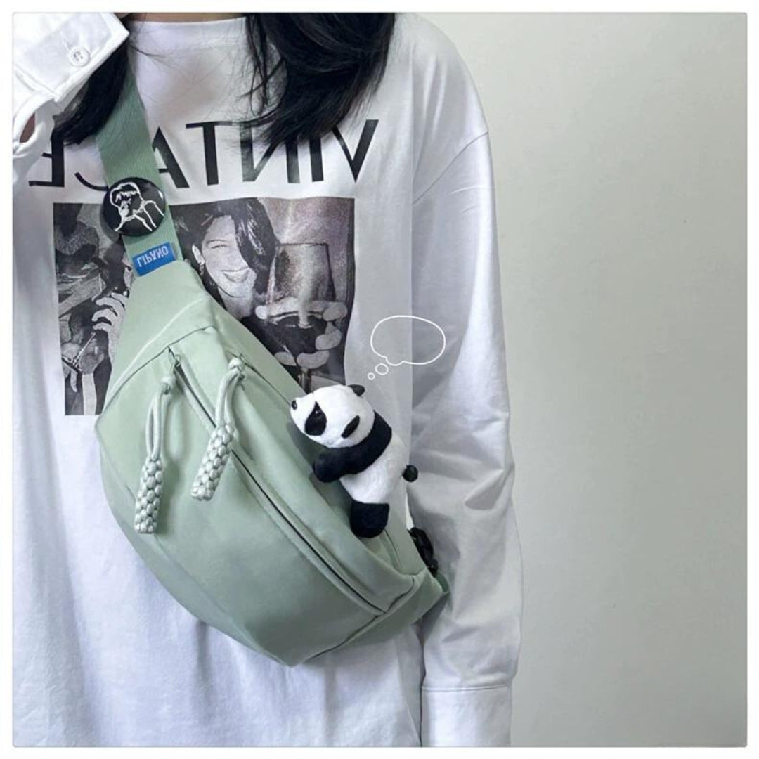 Solid-color cross-body bag for travel with pendant