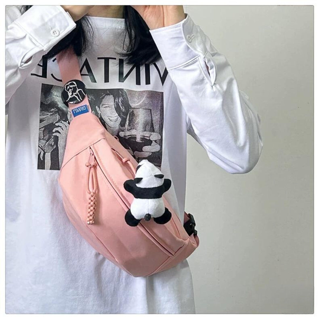 Solid-color cross-body bag for travel with pendant