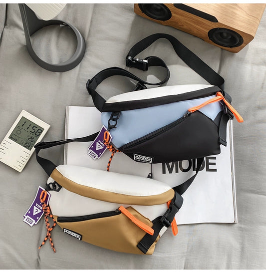 Trendy crossbody chest bag for boys and girls with bonus pendant.